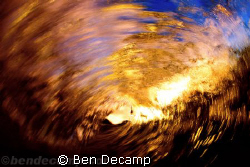 Empty wave at sunset looking out, surfer's perspective. by Ben Decamp 